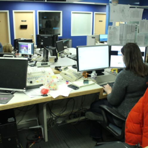 The assignment desk at WBZ-TV has several work stations and overlooks the newsroom.